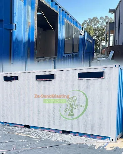 Blue shipping container with sandblasted grey panels ready for coating